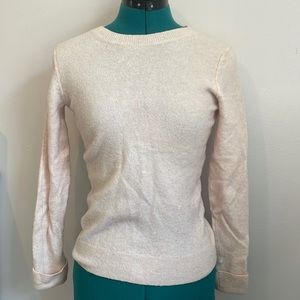tight fitting light pink sweater